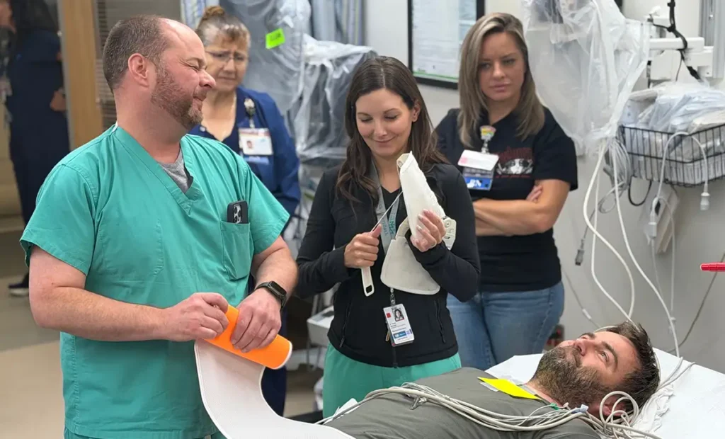 UNM trauma instructors lead a hands-on trauma assessment scenario with Artesia General Hospital emergency department staff during the Rural Trauma Team Development Course.