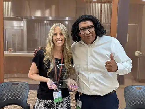 Kristi Harvey holds her Employee of the Quarter award plaque while standing with the Director of the Accounting Department during the recognition presentation at Artesia General Hospital.
