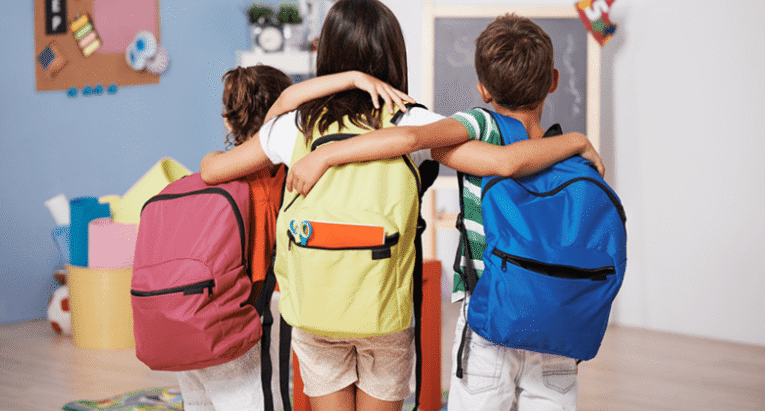 Three kids with backpacks